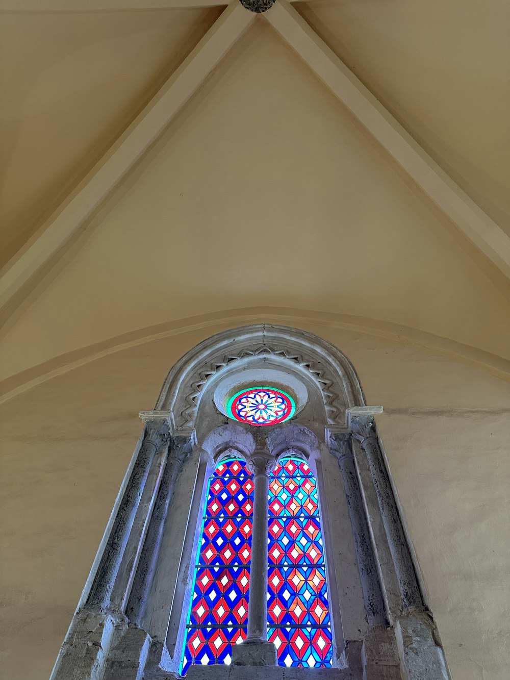 a large stained glass window in a church