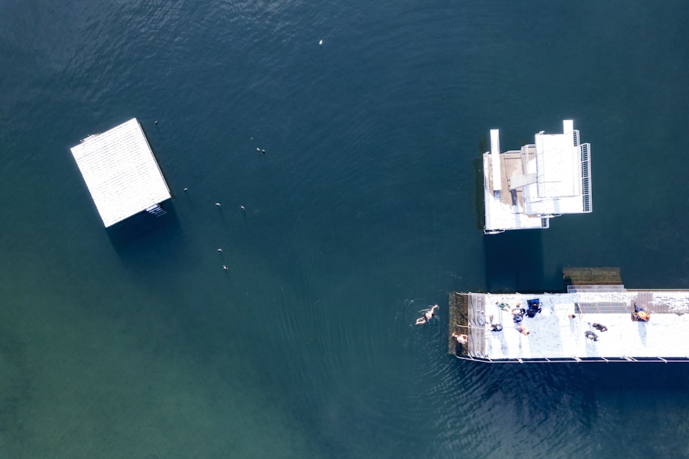 a couple of boats floating on top of a body of water