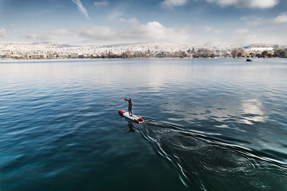 a boat floating on top of a large body of water