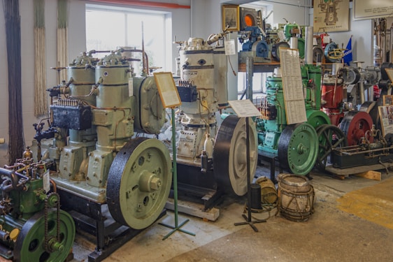 A diverse range of industrial machinery displayed in a well-lit showroom.
