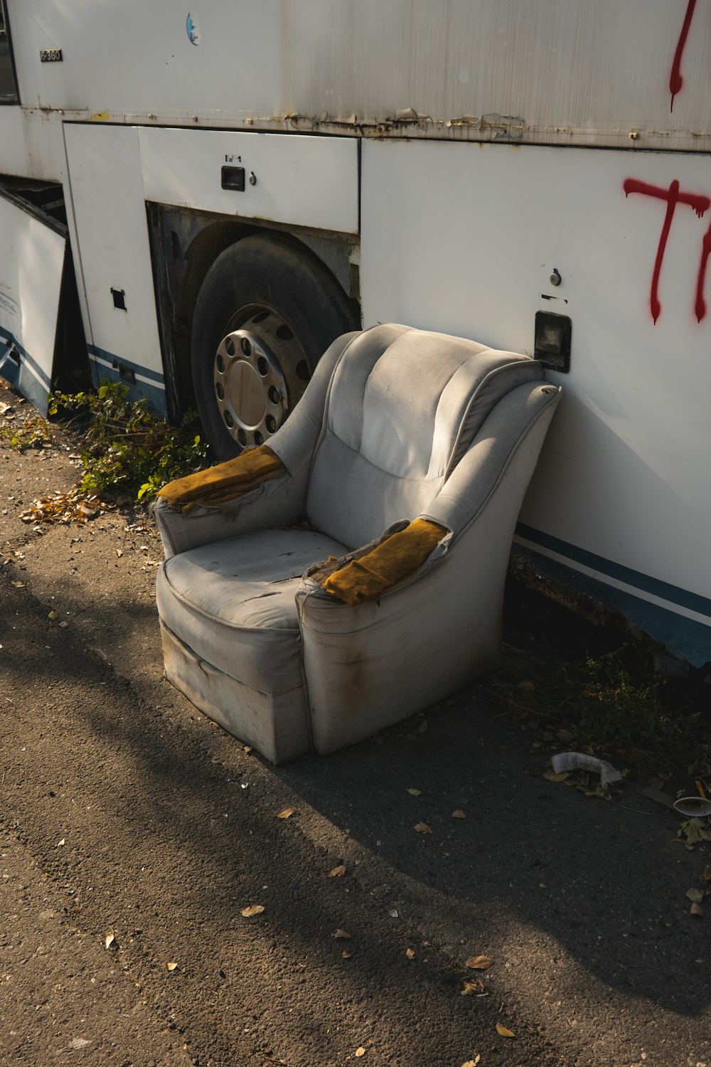 a couch sitting on the side of a bus