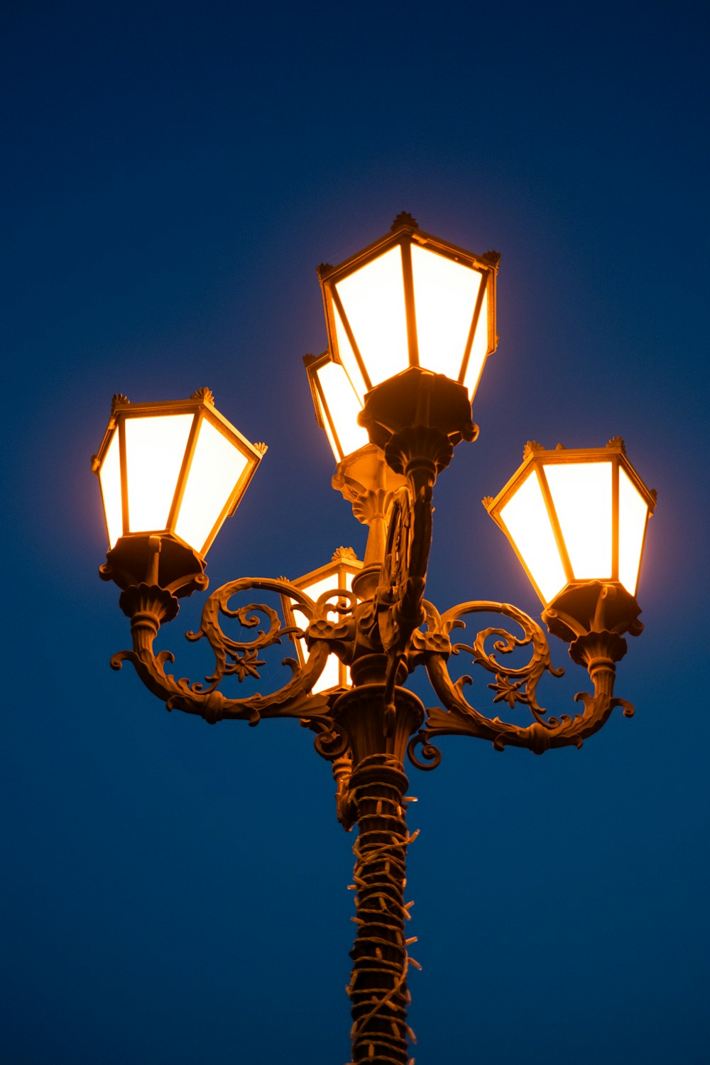 a street light with four lights on it