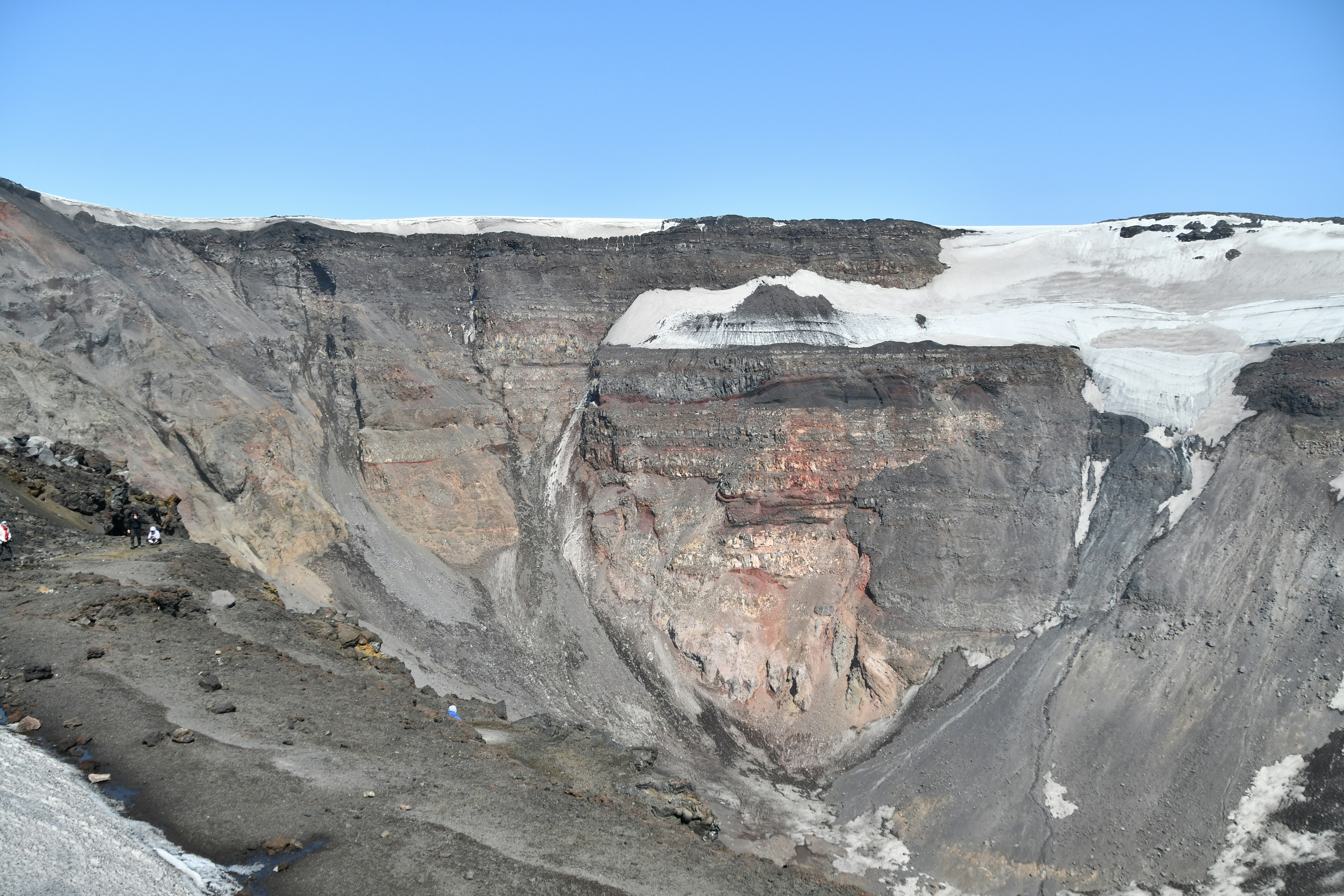 a very large mountain with a very steep side