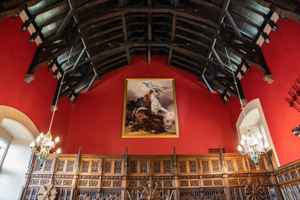 a large room with a painting on the wall