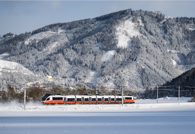 a train traveling through a snow covered countryside
