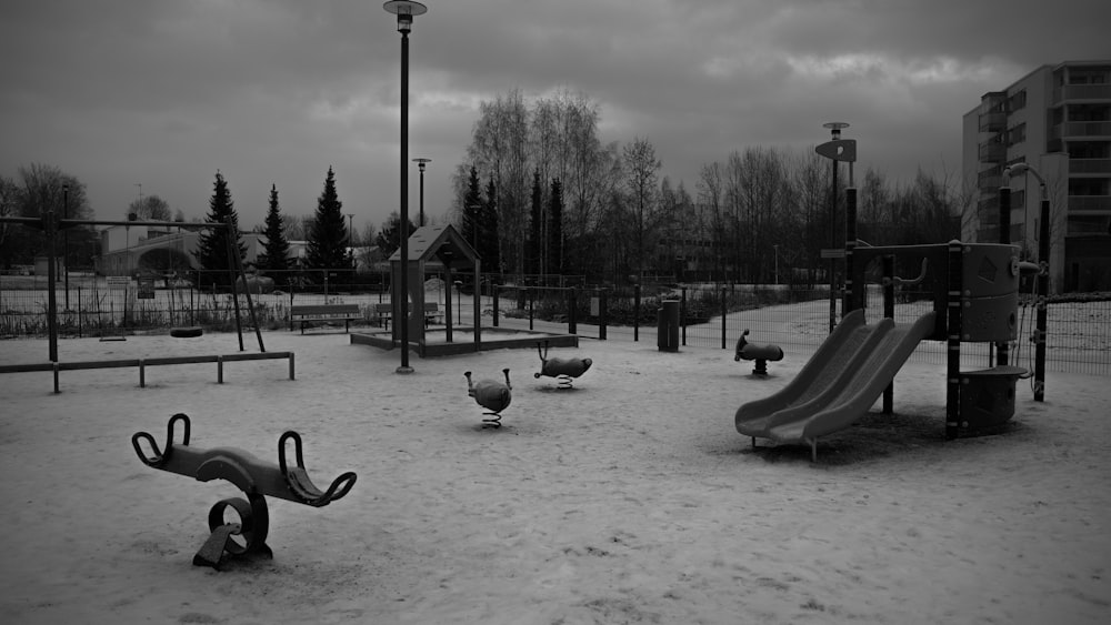 a black and white photo of a playground