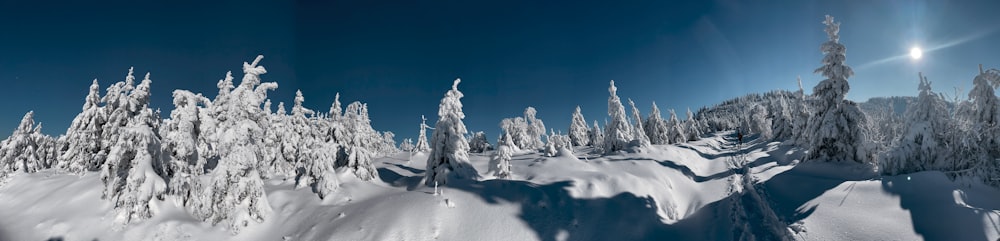 the sun shines brightly over a snowy mountain