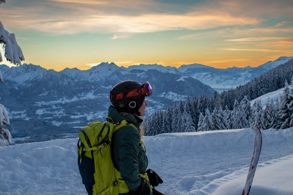 a person with a snowboard on a snowy mountain