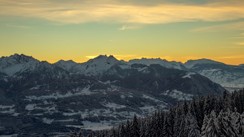 a view of a mountain range at sunset