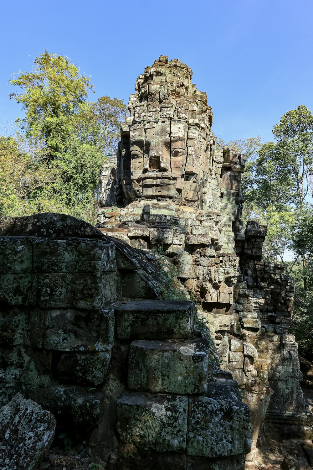 a large stone structure with a face on top of it