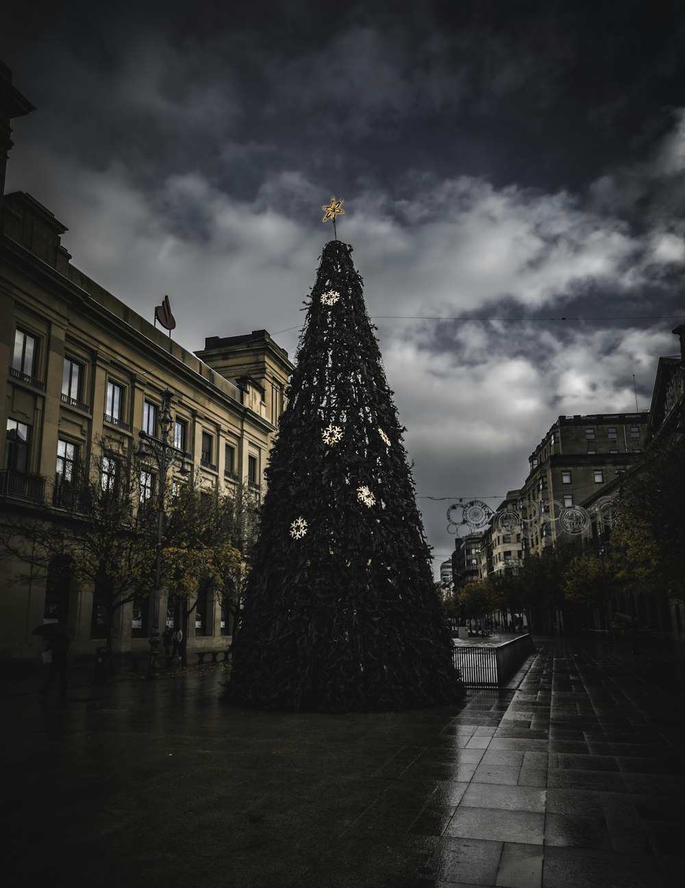 a large christmas tree in the middle of a city