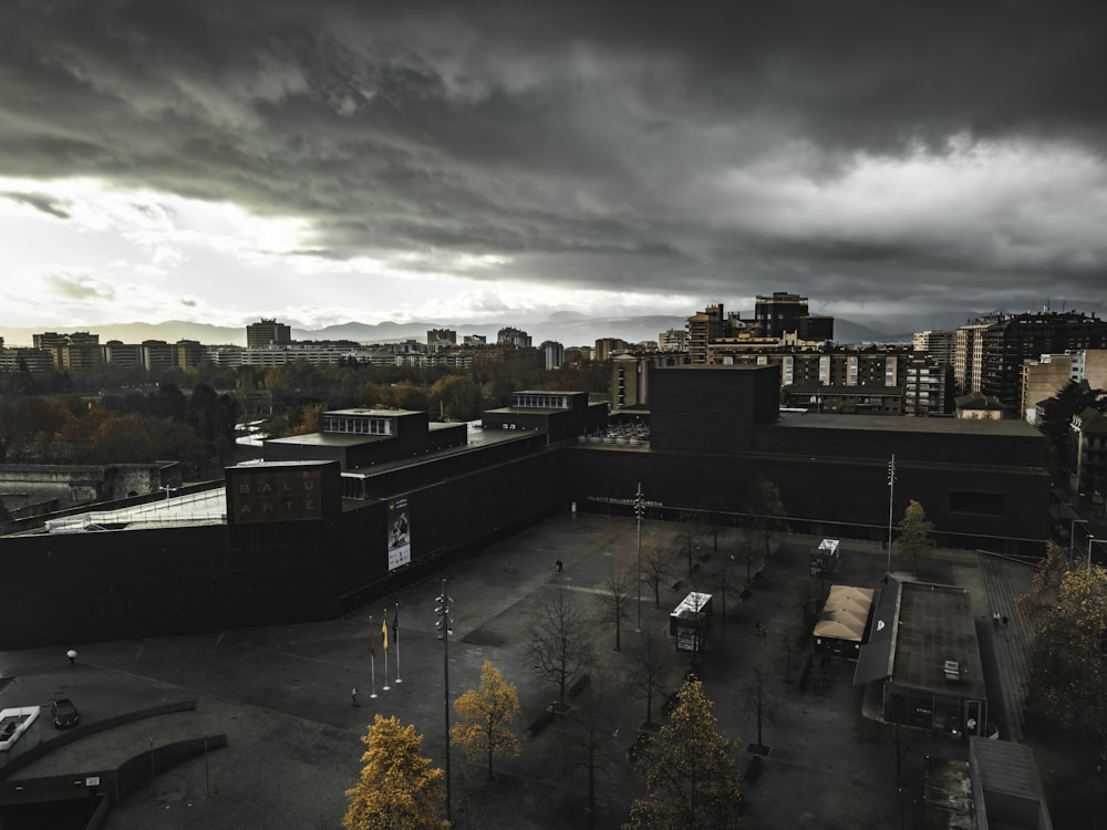 a cloudy sky over a city with buildings