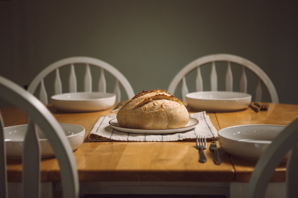 a loaf of bread sitting on top of a white plate