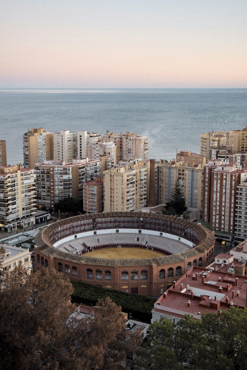 an aerial view of a large arena in a city