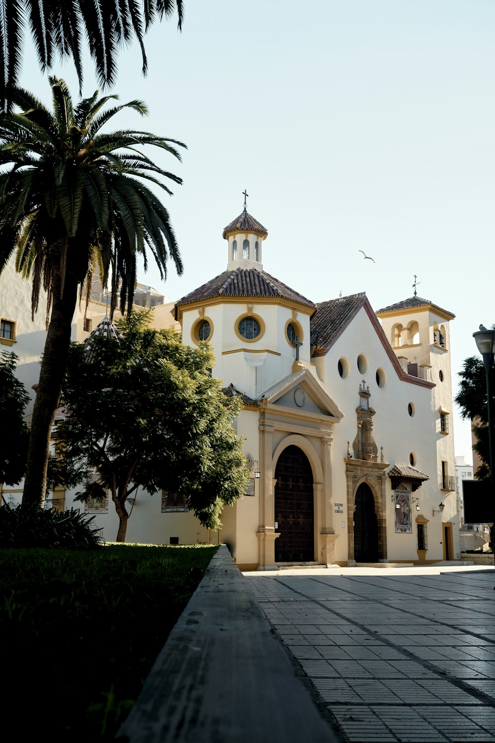 a large white building with a clock on it's side