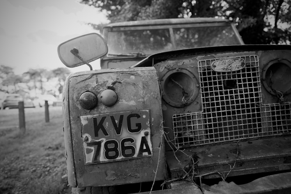 a black and white photo of an old truck