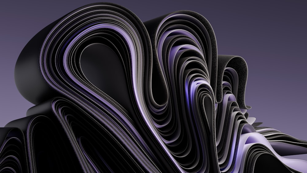 a bunch of black and purple papers stacked on top of each other