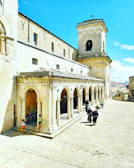 Local children playing near historic stone buildings in Moroni's old town