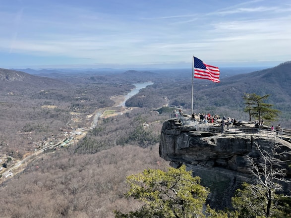 A group of diverse veterans standing together in a scenic Appalachian landscape.