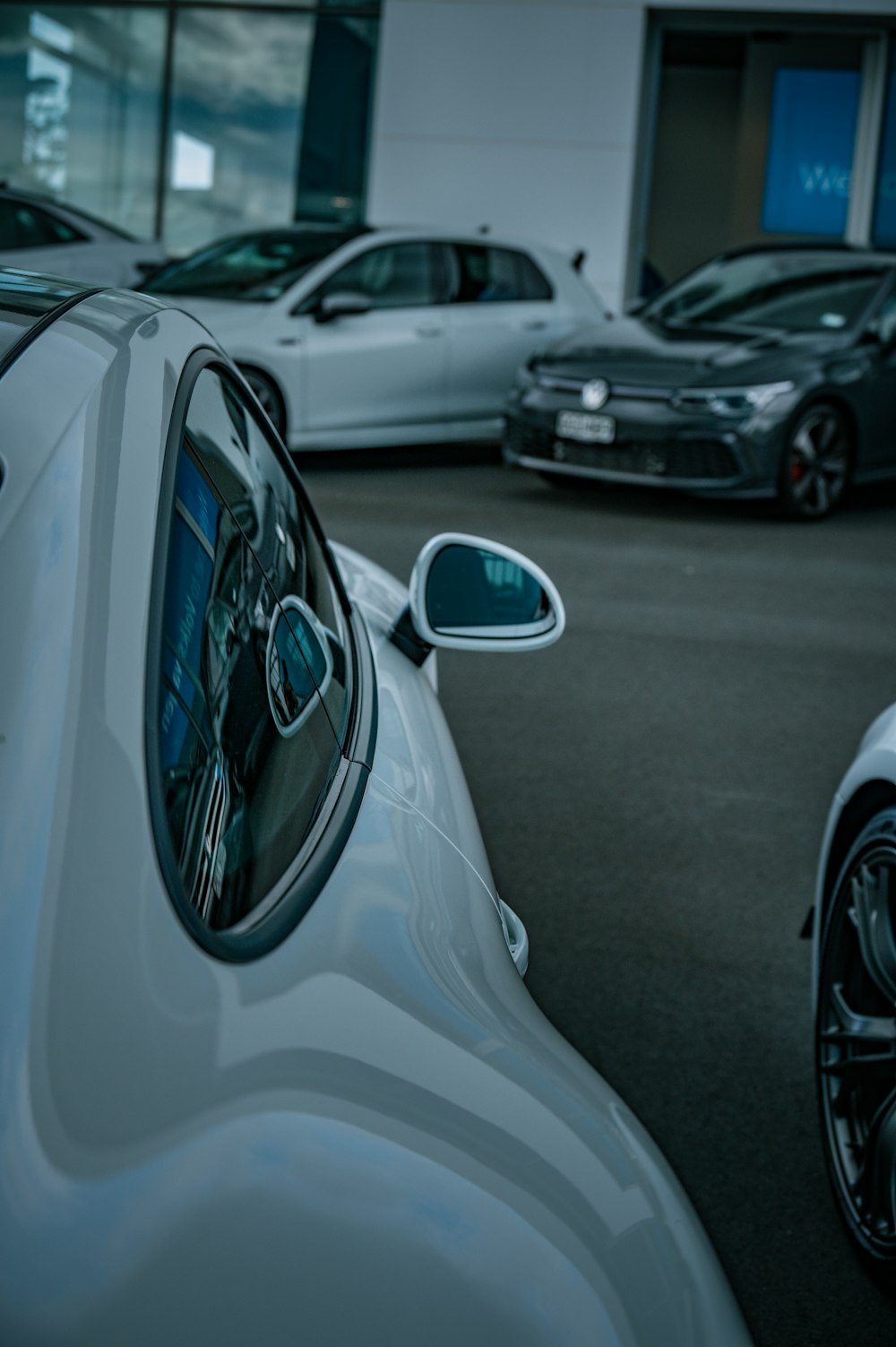 a group of cars parked next to each other in a parking lot