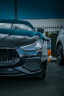 the front of a sports car with its hood up
