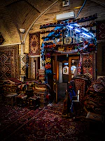 Warm, inviting interior of Zarafghan with traditional Afghan textiles and soft lighting.