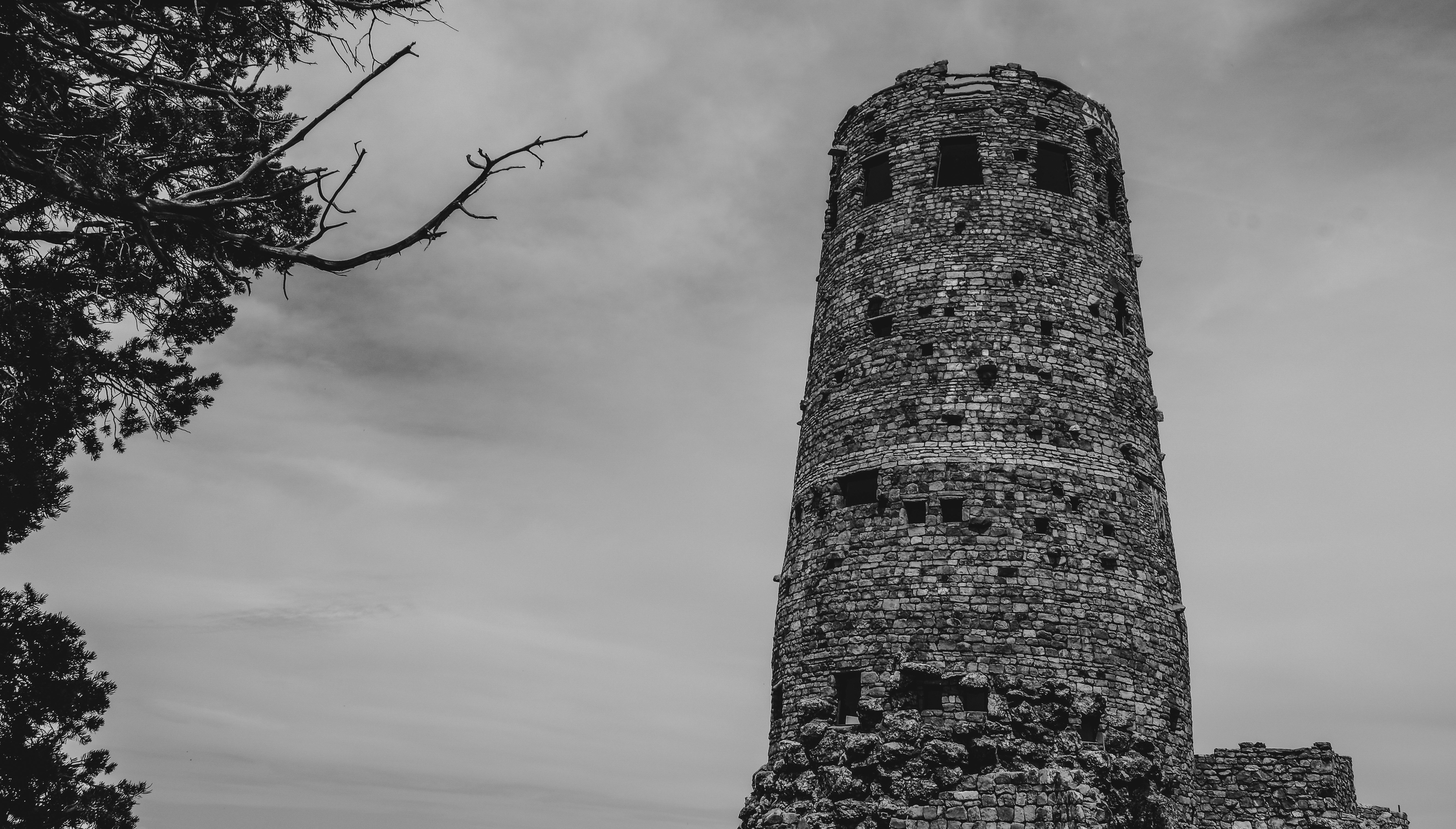 a black and white photo of a tall tower