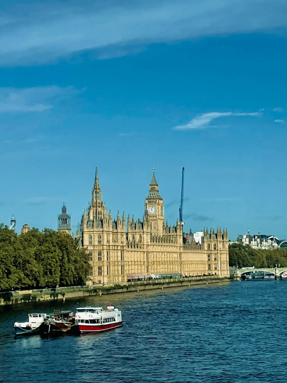 a large building sitting on the side of a river