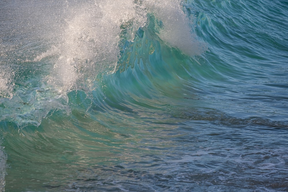 a person riding a surfboard on a wave in the ocean