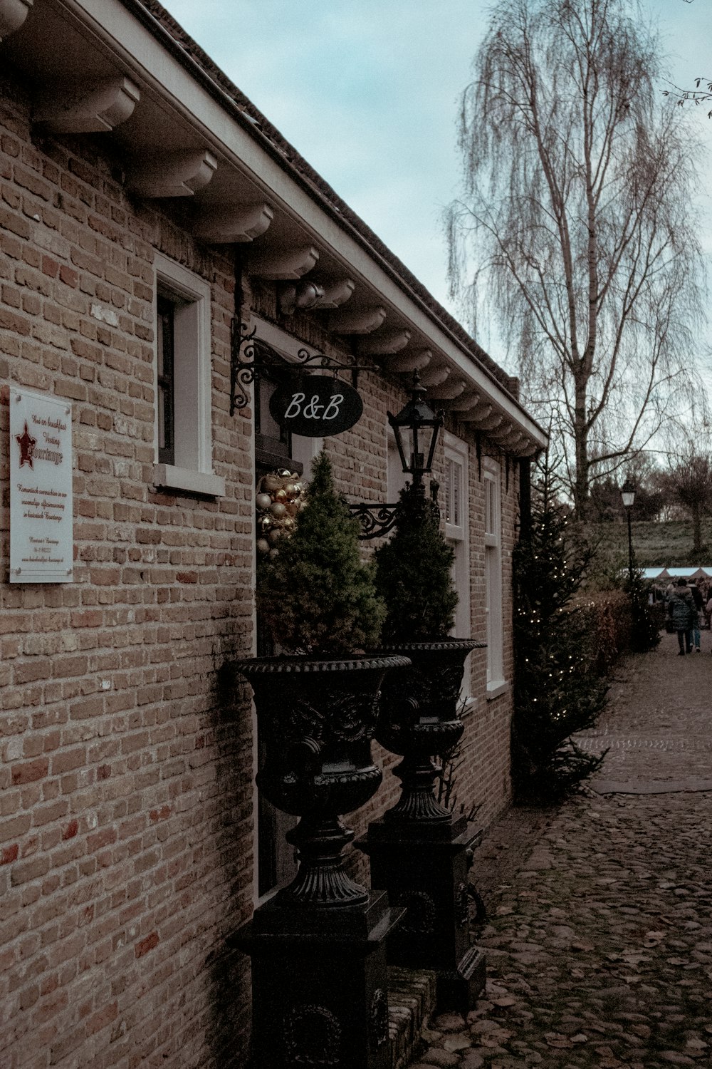 a brick building with a clock on the front of it