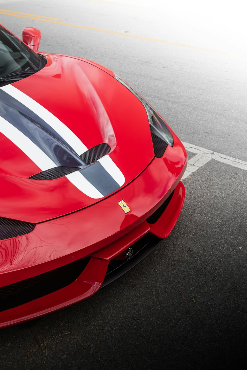 a red sports car parked in a parking lot