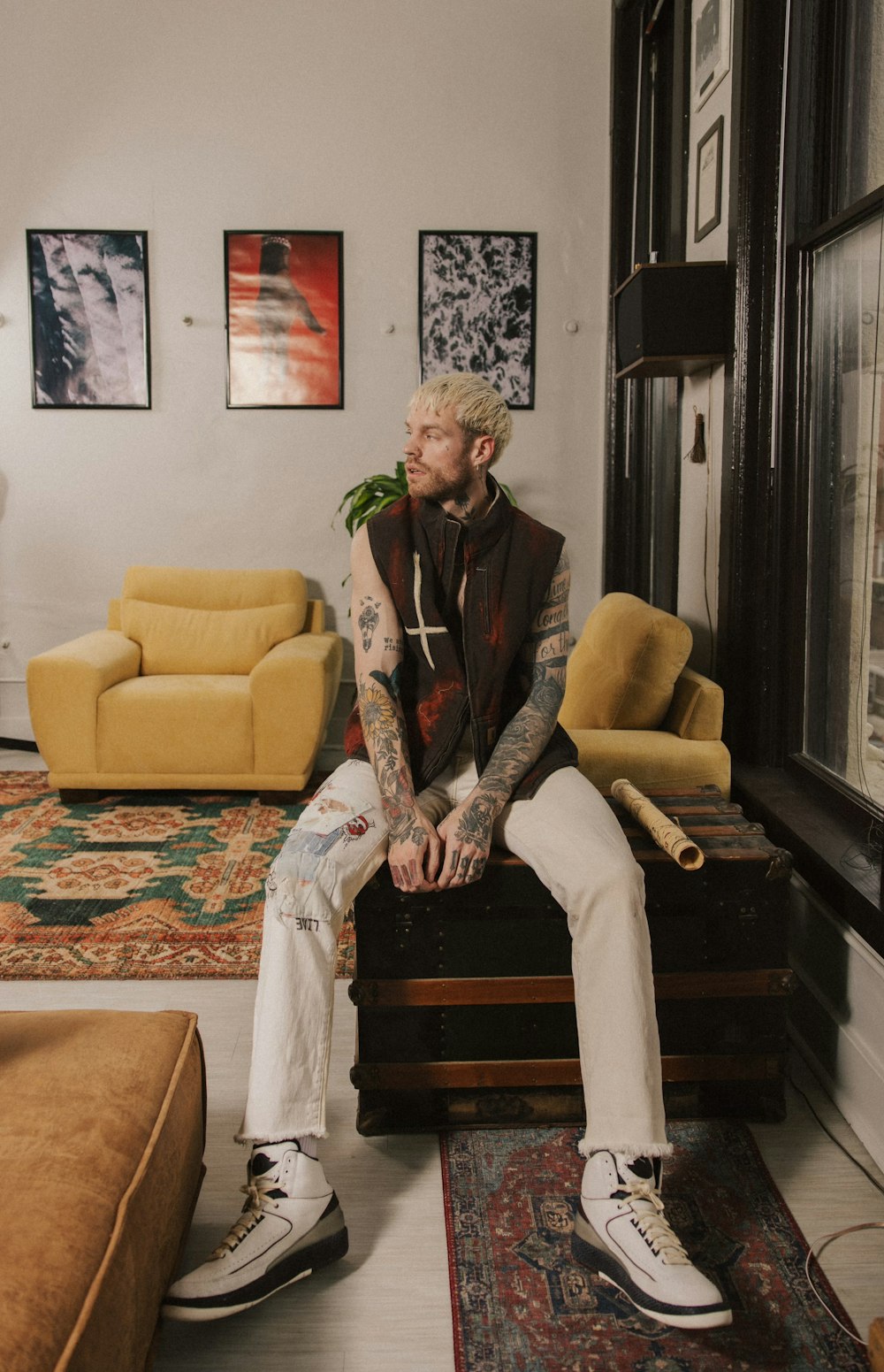 a man sitting on a couch in a living room