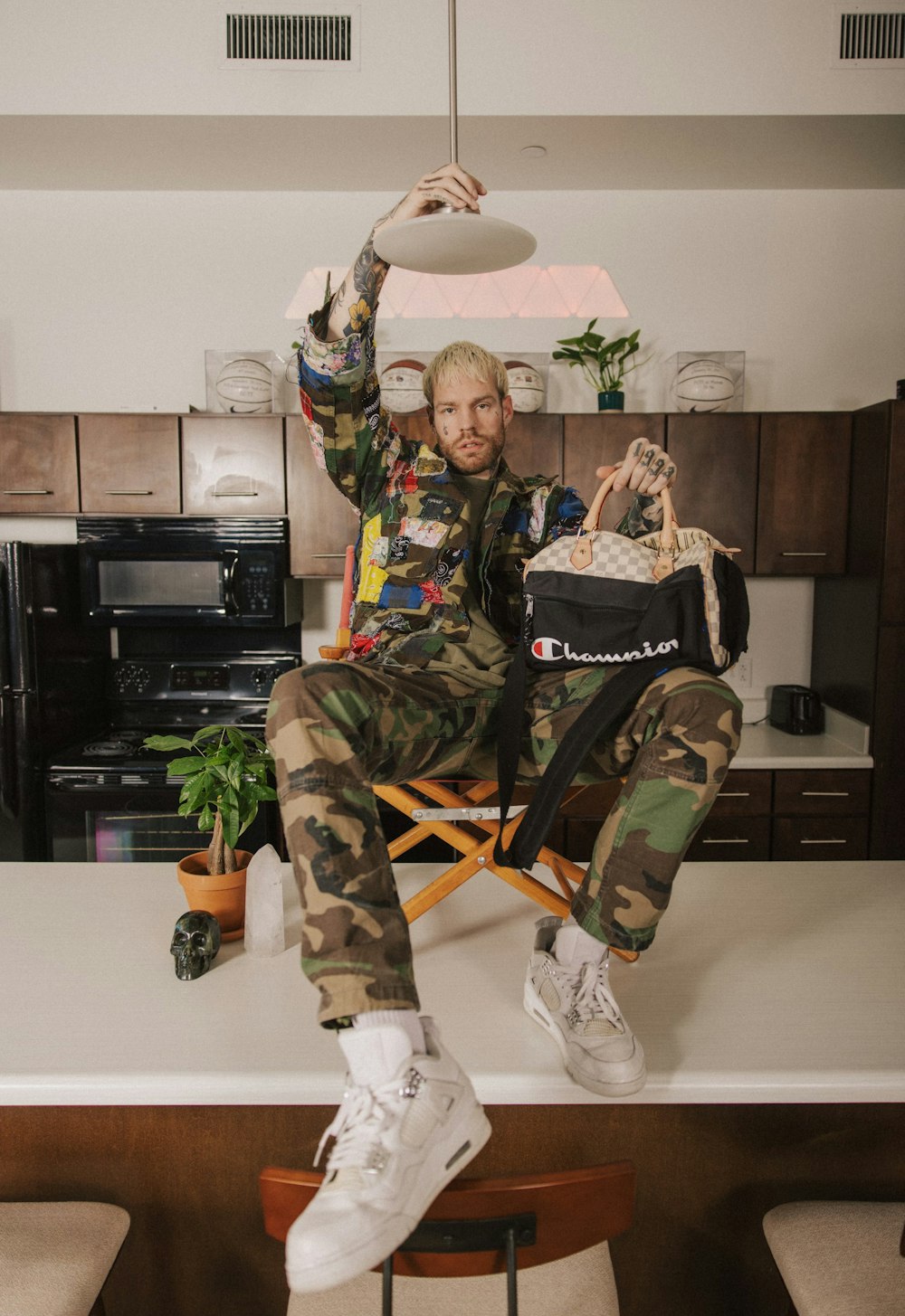 a man sitting in a chair holding a frisbee