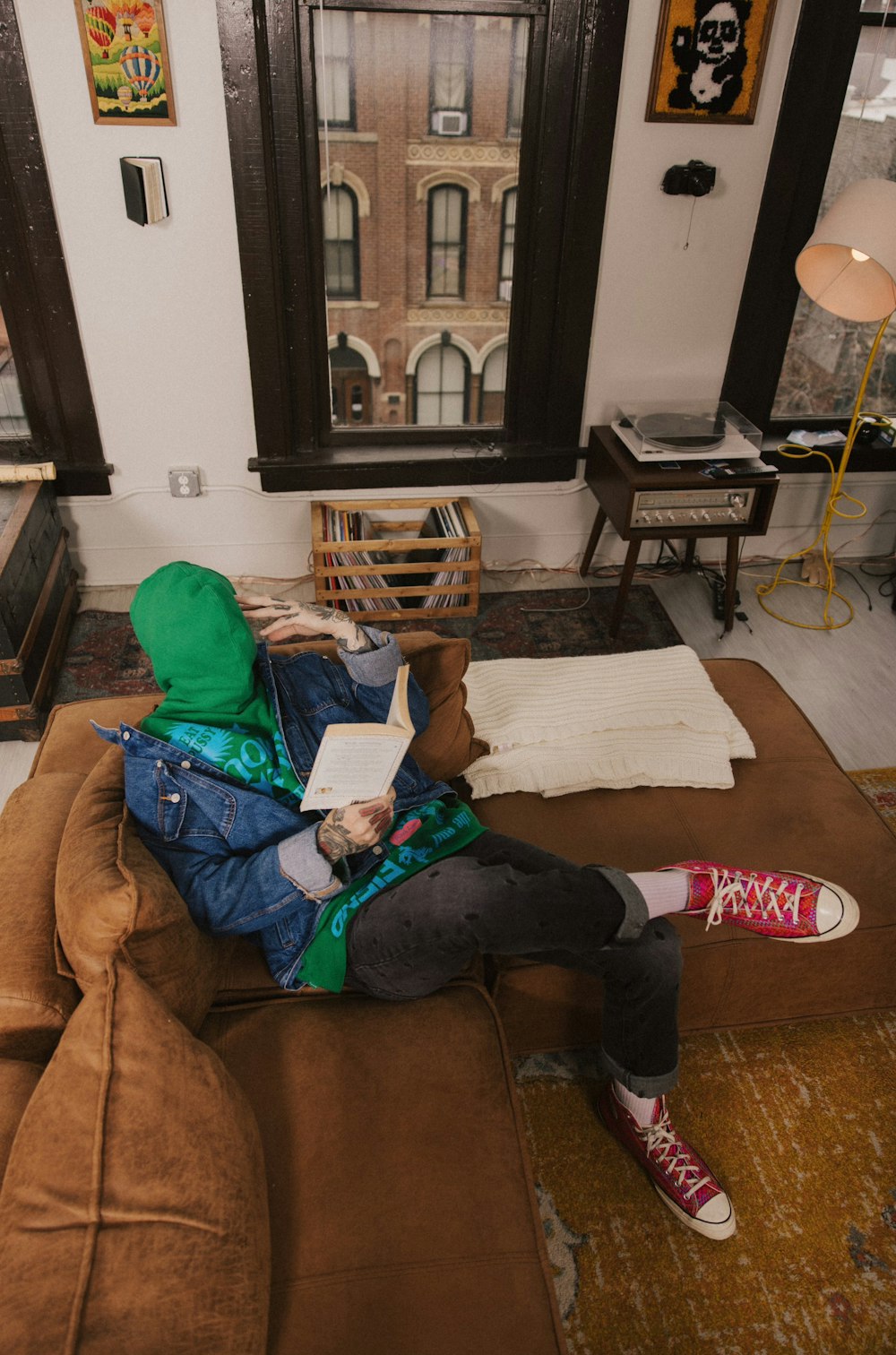 a person sitting on a couch in a living room