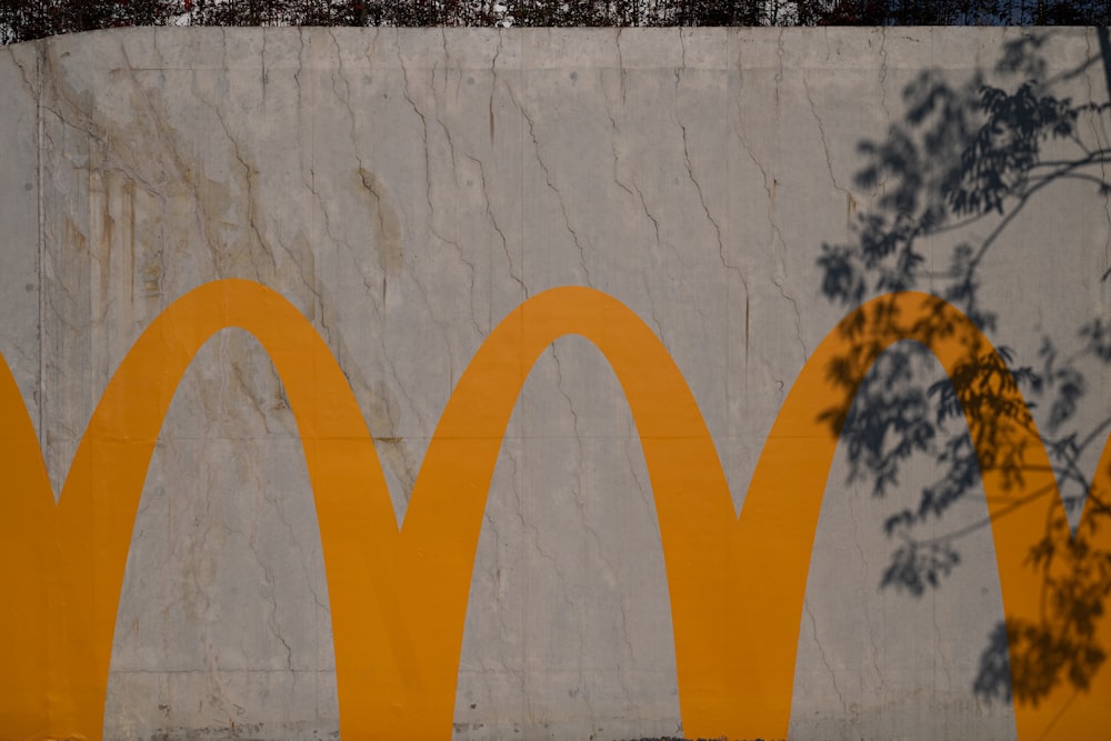 a large mural of a yellow mcdonald's logo