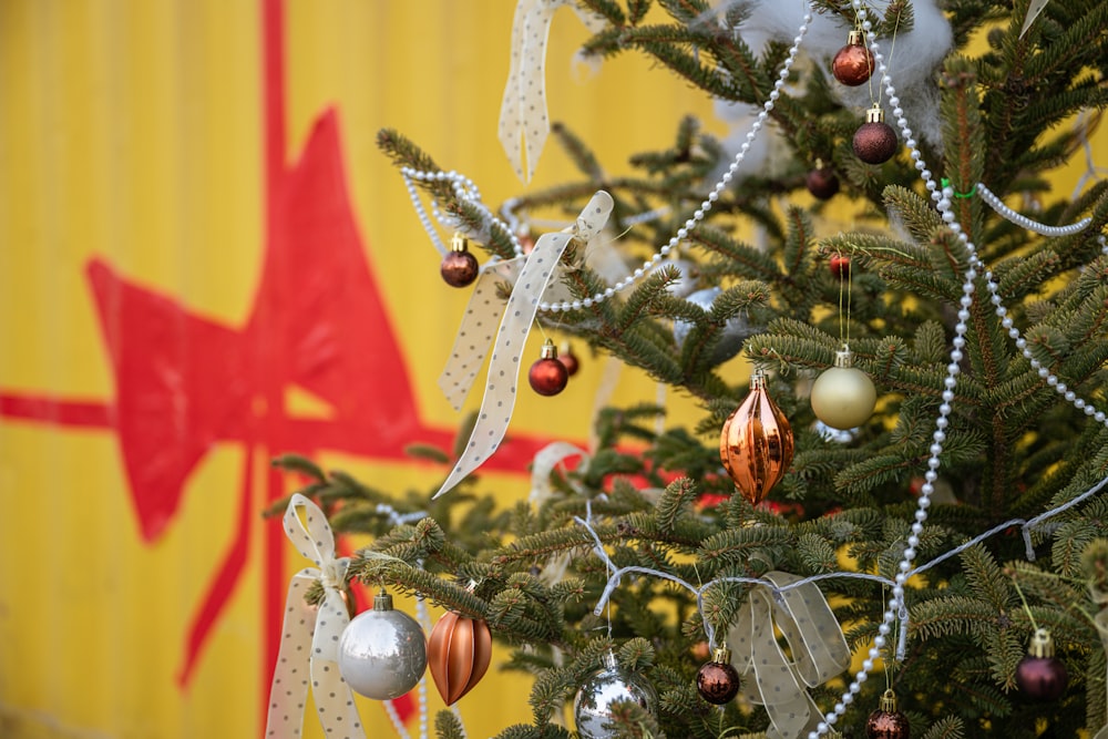 a christmas tree with ornaments hanging from it