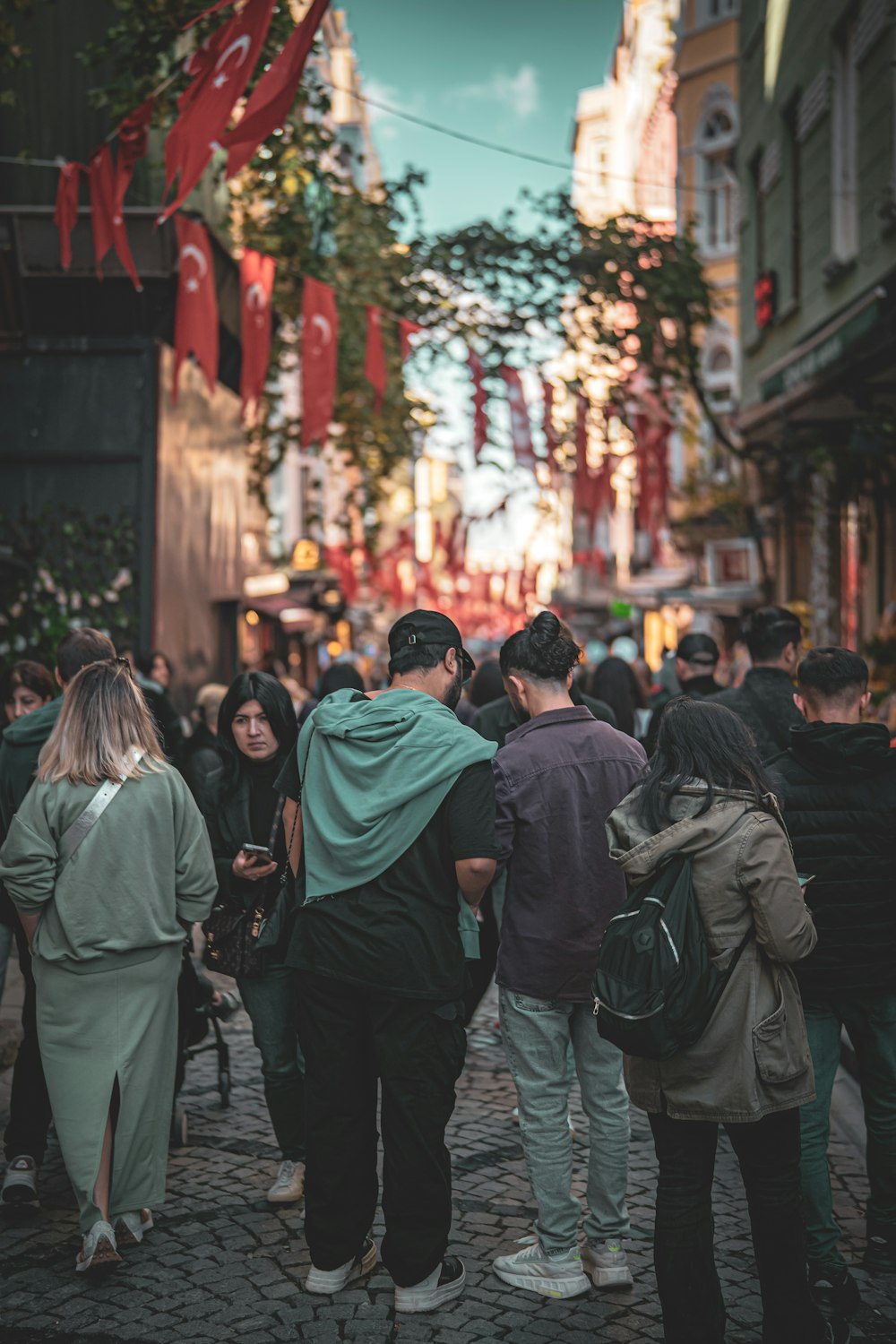 a group of people walking down a street