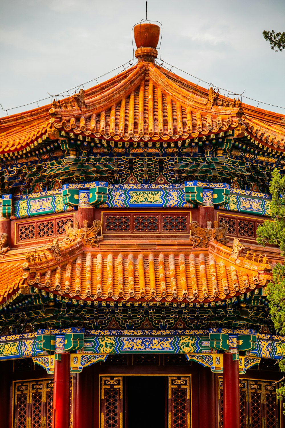 a tall building with a lot of colorful decorations on top of it