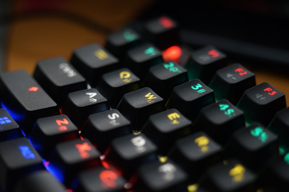 a close up of a computer keyboard with illuminated keys