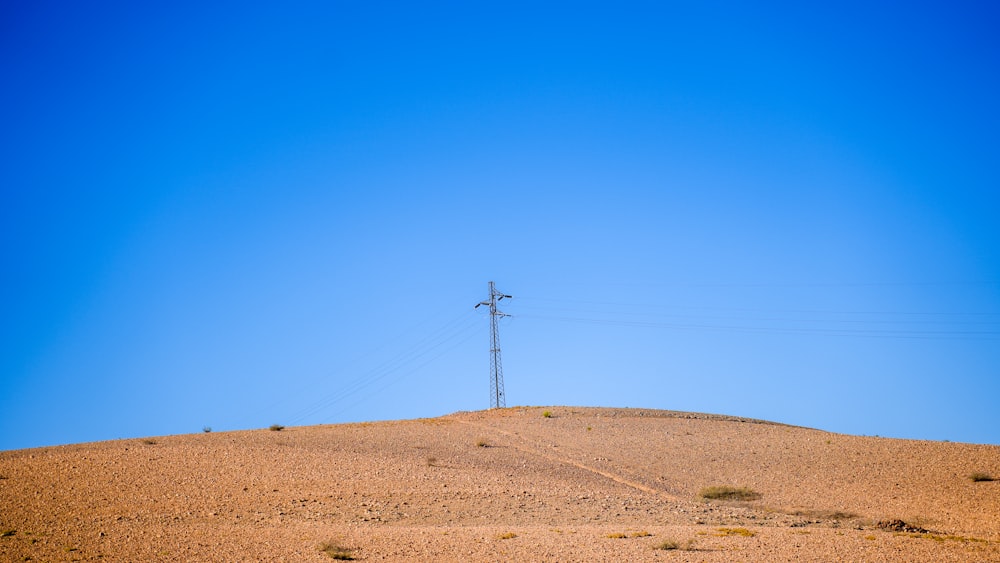 a telephone pole in the middle of a desert