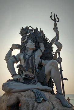 Powerful portrait of Shiva, calm yet fierce, with his trident and crescent moon.