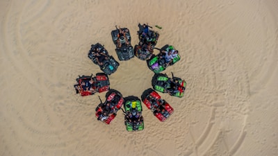 A group of friends riding ATVs together, laughing and enjoying the rugged terrain.