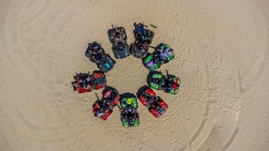 A group enjoying an exciting quadricycle ride through sandy trails near Rio do Fogo.
