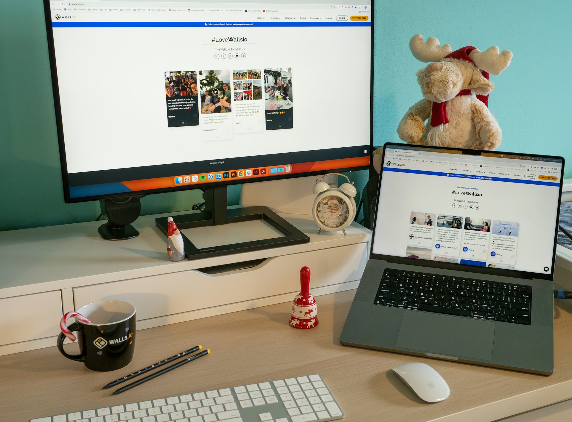 a laptop computer sitting on top of a desk next to a monitor