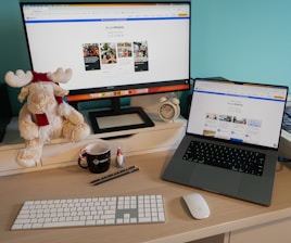 A serene workspace showcasing wrapped gifts and a computer with a shopping website.