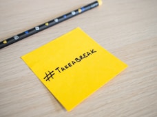 a note with the word take break written on it next to a pencil
