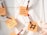 Sticky notes attached with festive-themed clothespins are displayed on a metallic grid, featuring handwritten ideas for holiday marketing campaigns. A small plush heart is also visible.