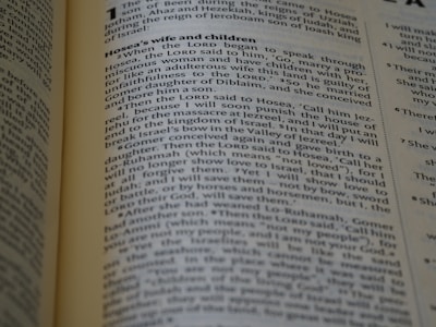 The page from a religious text, likely a Bible, includes paragraphs discussing Hosea's wife and children with detailed passages of biblical narrative. The text is formatted in two columns with a heading at the top.