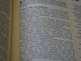 The page from a religious text, likely a Bible, includes paragraphs discussing Hosea's wife and children with detailed passages of biblical narrative. The text is formatted in two columns with a heading at the top.