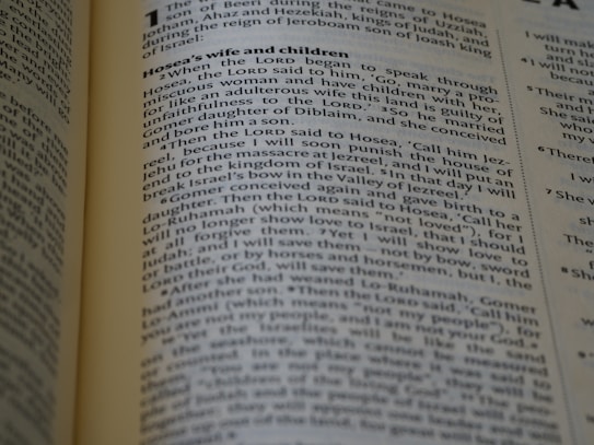 The page from a religious text, likely a Bible, includes paragraphs discussing Hosea's wife and children with detailed passages of biblical narrative. The text is formatted in two columns with a heading at the top.
